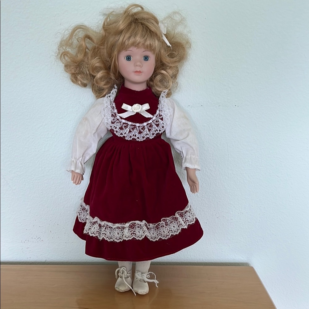 Porcelain doll with lace dress.